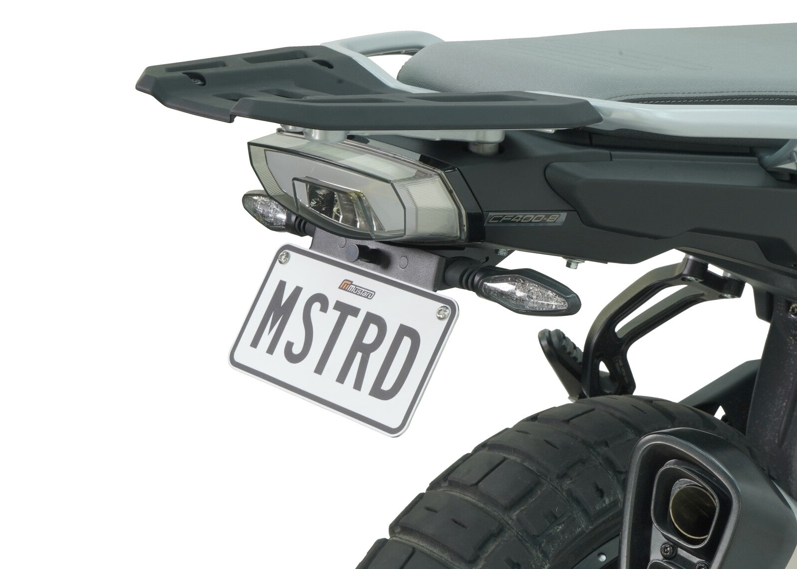 A motorcycle fender eliminator kit, featuring a black aluminum license plate holder with an LED light, mounted on the rear of a motorcycle.
