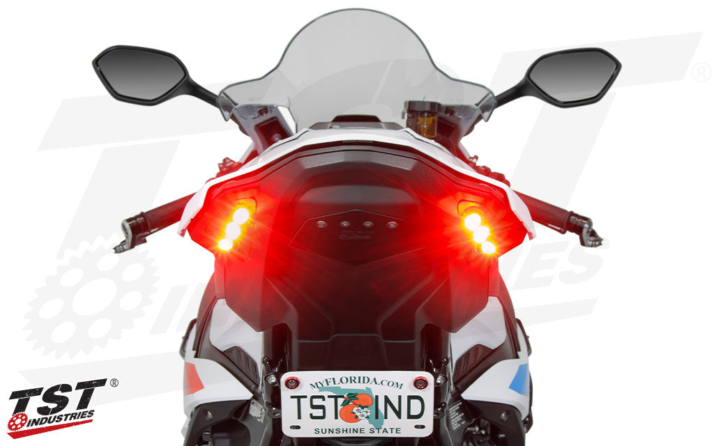 A BMW S1000RR Motorcycle, with TST Integrated tail light installed against a white background. The image is of the tail of the motorcycle.