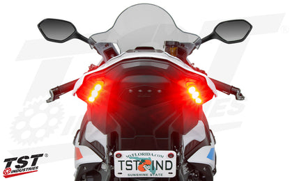 A BMW S1000RR Motorcycle, with TST Integrated tail light installed against a white background. The image is of the tail of the motorcycle.