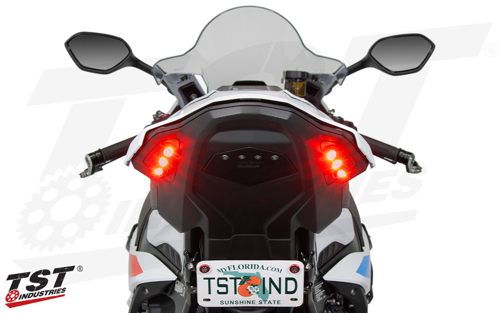 BMW S1000RR Motorcycle with red integrated tail light and TST Industries branding on a white background