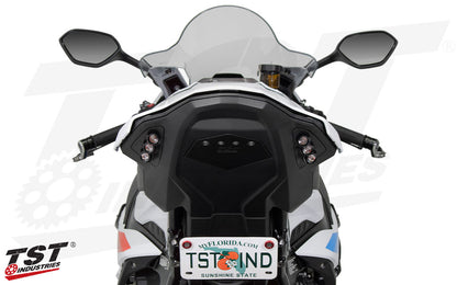 BMW S1000RR Motorcycle with TST Industries branding on a white background. Integrated tail light is off.