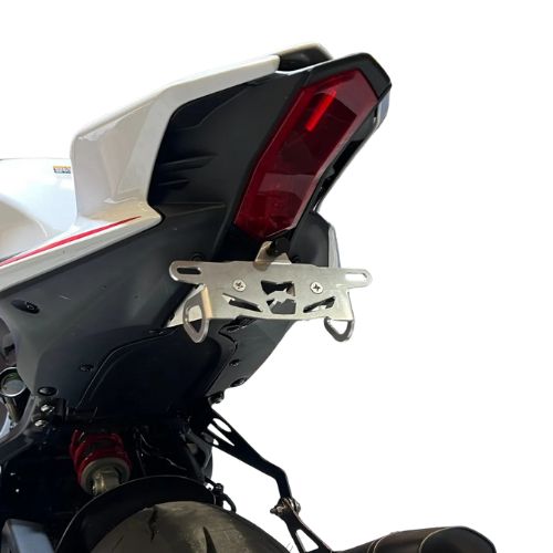 A yamaha r9 tail tidy in aluminium metal, mounted to the rear of the motorcycle, pictured at an angle with white background